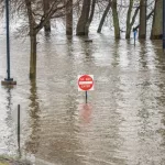 East Hartford^ Connecticut^ USA - April 20^ 2019: Heavy rain and snow melting cause flooding of the Connecticut river at Great River Park in East Hartford^ Connecticut