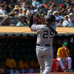 New York Yankees' Gio Urshela #29 takes a warm up swing before pinch hitting during a game against the Oakland Athletics at RingCentral Coliseum. Oakland^ California - August 28^ 2021