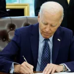 U.S. President Joe Biden signs a proclamation in the Oval Office of the White House. WASHINGTON^ DC - AUGUST 16