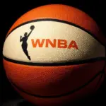 Generate a basketball with the WNBA logo^ the background must be completely black but the ball must be illuminated artistically.