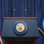 Federal Reserve System Fed of USA chairman press conference concept. Tribune with symbol and flag of FRS and United States. 3d illustration