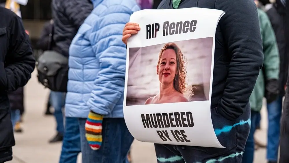 Protest sign honoring Renee Nicole Good during demonstration. Toronto^ Canada - January 10^ 2026.