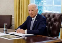 U.S. President Joe Biden speaks to members of the news media while receiving a briefing about the ongoing wildfire season in the Oval Office at the White House on September 17^ 2024 in Washington^ DC.