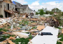 Debris from destroyed homes and property is strewn across areas of St. Louis^ Missouri after tornadoes hit the Saint Louis area on Friday^ April 22^ 2011.
