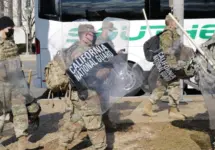 California National Guard troops prepare to board a bus for their return home after completing their assignment in Washington during the inauguration. Washington^ DC – January 22^ 2021