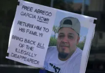 protest sign reading: "Free Abrego Garcia Now" Return Him To his family! Bring back all of the illegally disappeared! NEW YORK^ NEW YORK USA - May 1^ 2025 on International Workers' Day in Lower Manhattan.