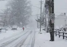 Person is walking in snow storm day on North Taylor Avein Norwalk NORWALK^ CT^ USA -FEBRUARY 7^ 2021