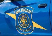 State of Michigan police coat of arms on squad car Dimondale MI - June 4^ 2022