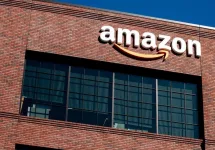 Closeup of Amazon logo on the company office building in East Palo Alto^ Silicon Valley^ San Francisco Bay Area. Amazon sign on brick building wall East Palo Alto^ California US - October 17^ 2024