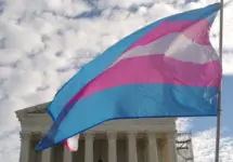 A transgender pride flag flies in front of the U.S. Supreme Court building in Washington^ DC.