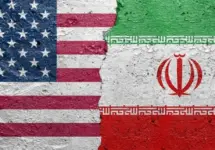 United States of America vs Iran - Cracked concrete wall painted with a USA flag on the left and a Iranian flag on the right