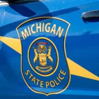 State of Michigan police coat of arms on squad car Dimondale MI - June 4^ 2022