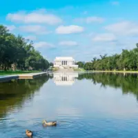 World famous Lincoln Memorial reflected in the water under a cloudy sky. Washington D.C.^ USA