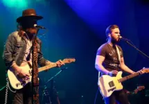 NEW YORK-MAY 6: Singers T.J. Osborne (R) and John Osborne of Brothers Osborne perform onstage at the Paramount on May 6^ 2016 in Huntington^ New York.