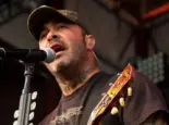 Aaron Lewis plays his guitar druing the performance of Staind Rockstar Uproar Festival on September 25^ 2012 in Nampa^ Idaho.