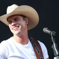 Country recording artist Dustin Lynch performs during the 'Kick The Dust Up' Tour at Vanderbilt Stadium on July 11^ 2015 in Nashville^ Tennessee.