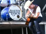 Dustin Lynch performs during the 'Kick The Dust Up' Tour at Vanderbilt Stadium on July 11^ 2015 in Nashville^ Tennessee.
