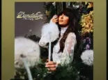 The image displays an Apple iPad running the Spotify app^ which shows the song "Be Her" by country artist Ella Langley from her album Dandelion.