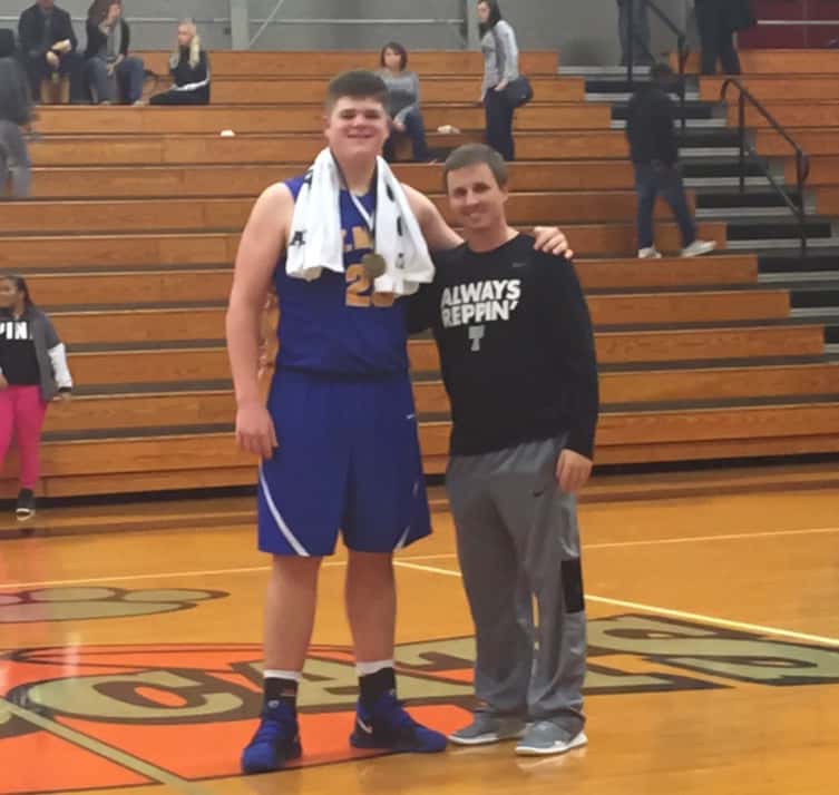 St. Mary senior Hale Sims scored 14 points and grabbed 11 rebounds for the Vikings in their semifinal win over Trigg County.  He is pictured with Trigg County basketball coach Payton Croft. 