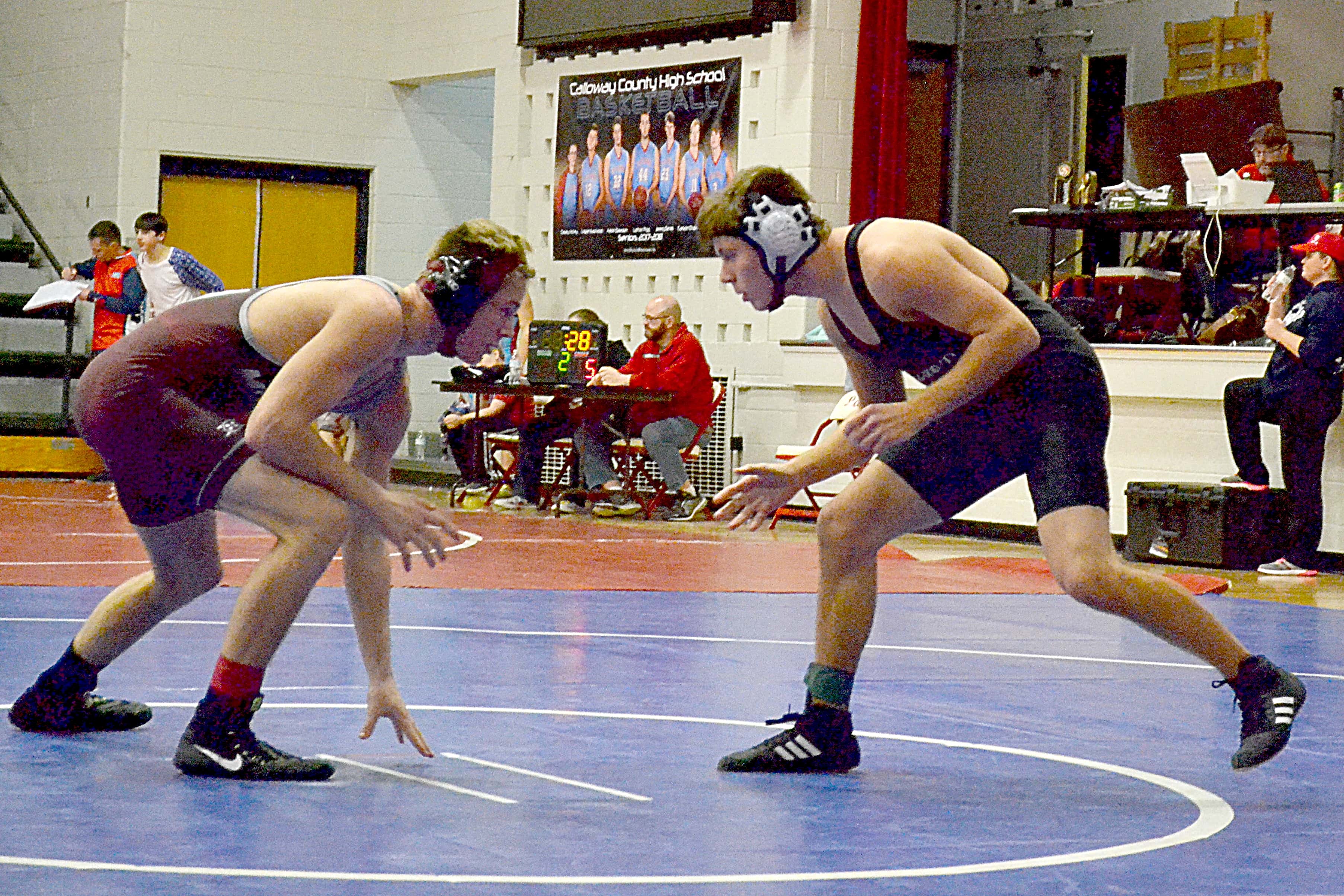 Trigg sophomore Alex Spears (right) faces off against McCracken County’s Hunter Vlach. Spears was 1-2 for the day at 145 lbs.: Trigg sophomore Alex Spears (right) faces off against McCracken County's Hunter Vlach. Spears was 1-2 for the day at 145 lbs.