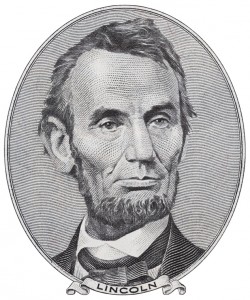president-abraham-lincoln-on-us-five-dollar-bill-macro-isolated-united-states-money-closeup