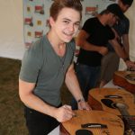 Hunter Hayes autographs charity items at Country Summer 2014 in Santa Rosa, CA. (Photo: Will Bucquoy)