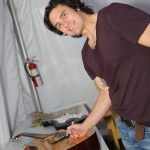 Joe Nichols autographs charity items backstage Country Summer 2014 in Santa Rosa, CA. (Photo: Will Bucquoy)