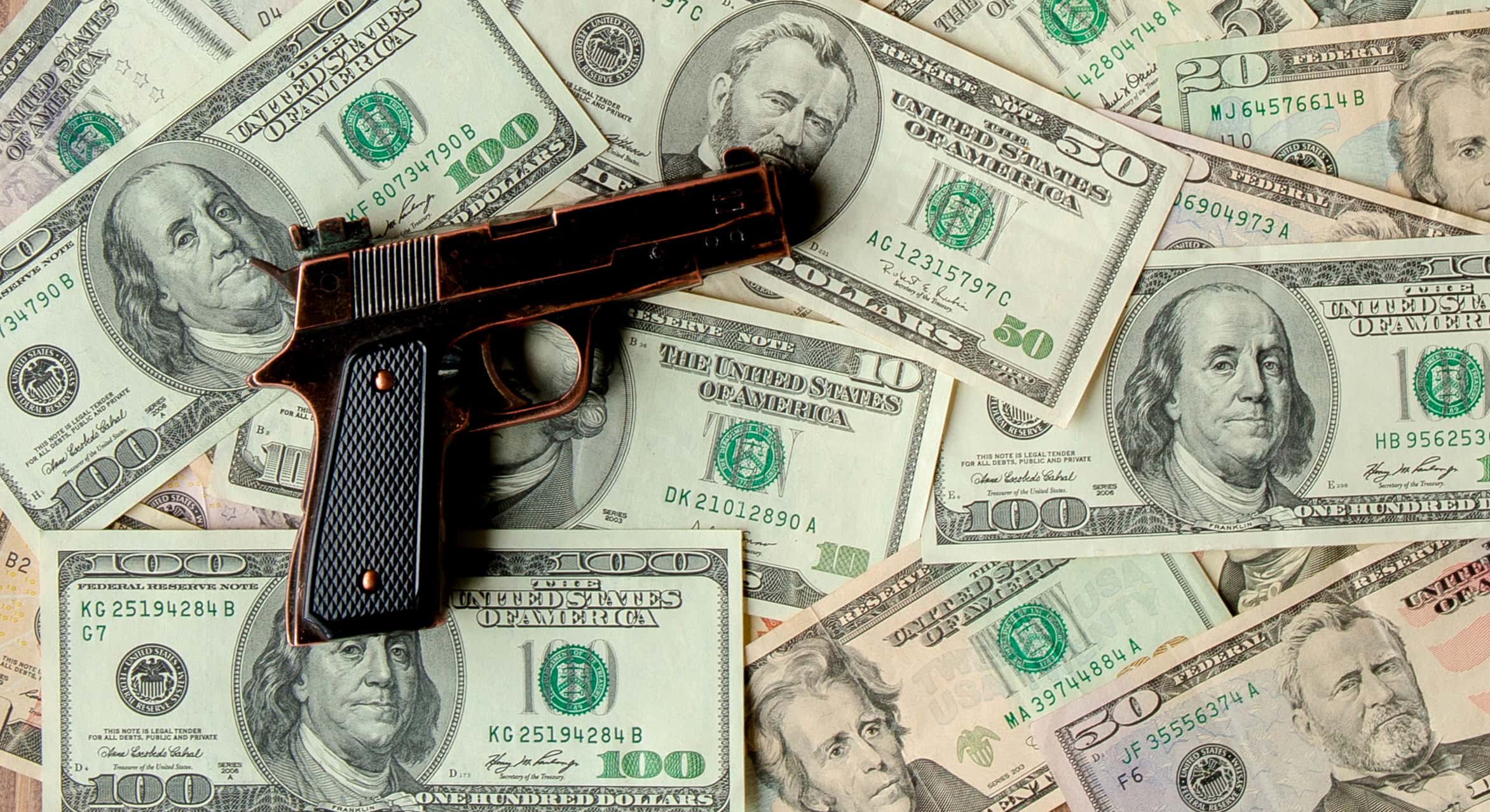 pistols-against-the-background-of-dollars