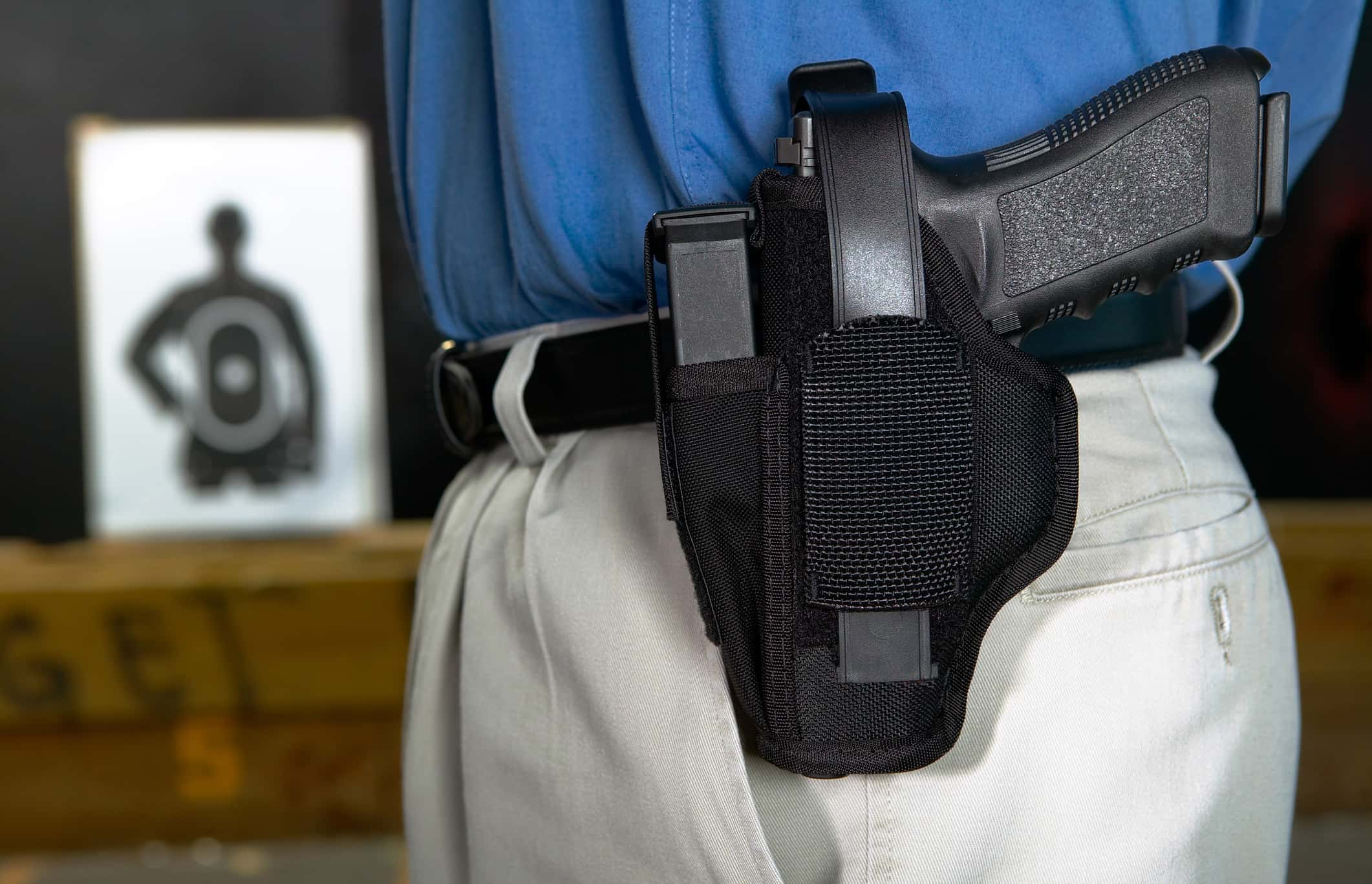 man-wearing-a-handgun-in-a-webbing-holster