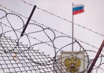 The concept of European and US sanctions pressure on the Russian Federation government. flag of the Russian Federation in barbed wire^ sanctions and aggression of Russia. Russian prison