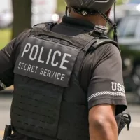 Rear view of an officer of the United States Secret Service Uniformed Division on patrol on a bicycle Washington DC^ USA - 30 April 2024