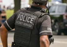 Rear view of an officer of the United States Secret Service Uniformed Division on patrol on a bicycle Washington DC^ USA - 30 April 2024