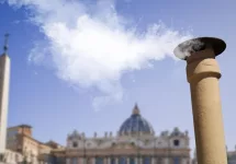Vatican City - 04-25-2025: White smoke from the chimney on top of the Sistine Chapel. It indicates that the Pope has been elected.