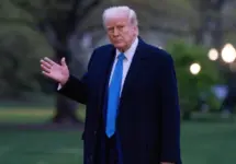 President Donald Trump walks across the south lawn after stepping off Marine 1 Washington DC^ United States^ April 6 2025