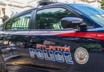 Atlanta police car and officer on cellphone Atlanta^ Ga USA - 06 07 20