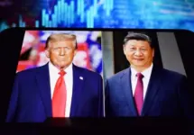 U.S. President Donald Trump and Chinese President Xi Jinping appear on a smartphone screen