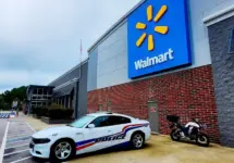 Police car parked in front of Walmart Store^ Fayetteville^ North Carolina^ USA^ August 6^ 2025