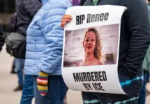 Protest sign honoring Renee Nicole Good during demonstration. Toronto^ Canada - January 10^ 2026.