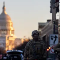 Members of the National Guard patrol the area surrounding the outskirts of the Capitol Building on January 19^ 2021^ in Washington D.C.