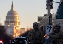 Members of the National Guard patrol the area surrounding the outskirts of the Capitol Building on January 19^ 2021^ in Washington D.C.