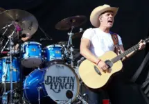 Dustin Lynch performs during the 'Kick The Dust Up' Tour at Vanderbilt Stadium on July 11^ 2015 in Nashville^ Tennessee.