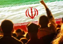 Defocus protest in Iran. Conflict war over border. World crisis. Country flag. Woman low rights. Male hands. Out of focus.