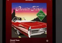 Apple iPad displays the Spotify music streaming application^ which is playing the song "Choosin' Texas" by the artist Ella Langley.