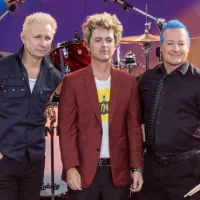 Mike Dirnt^ Billie Joe Armstrong^ Tre Cool pose on stage during ABC Good Morning America rock group Green Day concert in Central Park in New York on July 26^ 2024