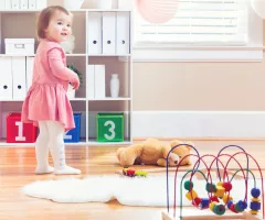 happy-toddler-girl-playing-with-toys