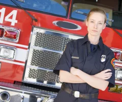 portrait-of-a-firefighter-by-a-fire-engine