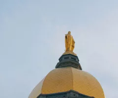 notre-dame-dome-statue-pan-down-south-bend-indiana-catholic-cinematic-4k-sbi-350551375