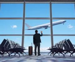 young-businessman-waving-good-bye-at-airport
