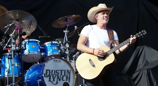 Dustin Lynch performs during the 'Kick The Dust Up' Tour at Vanderbilt Stadium on July 11^ 2015 in Nashville^ Tennessee.