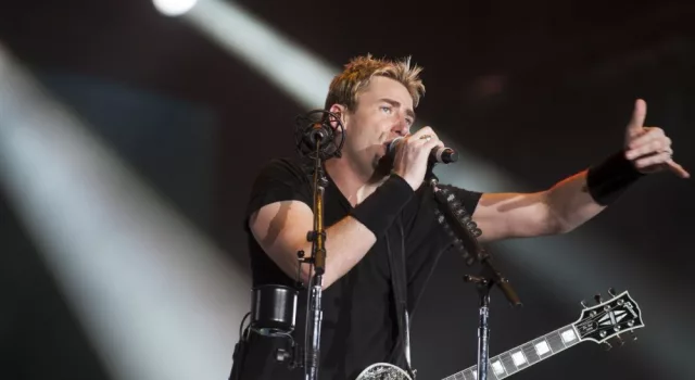 Chad Kroeger^ lead vocalist of the Canadian band Nickelback^ performs during the Rock in Rio 2013 concert^ on September 20^ 2013 in Rio de Janeiro^ Brazil.